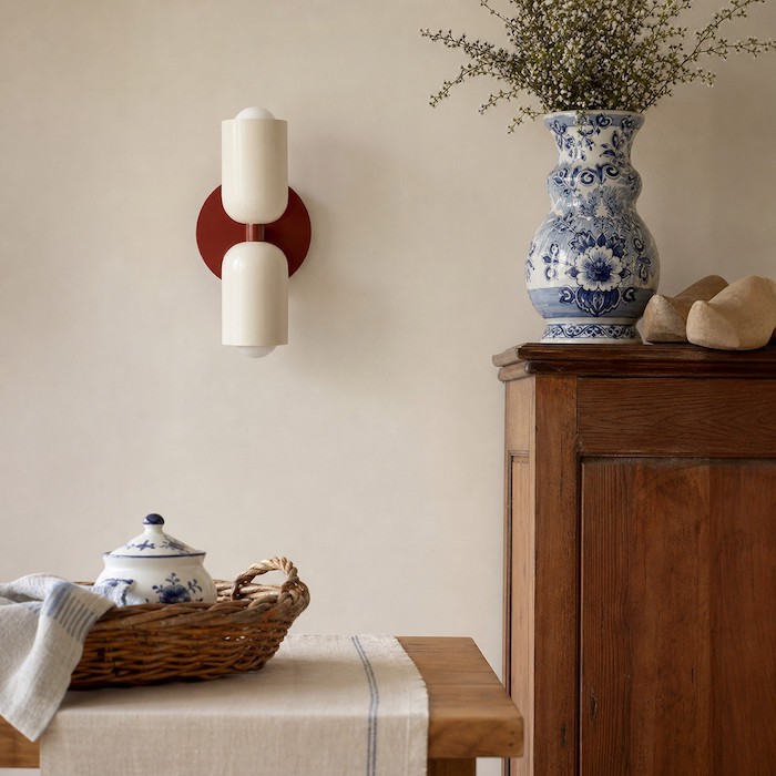Wall sconce placed near eye level with soft up-and-down light.