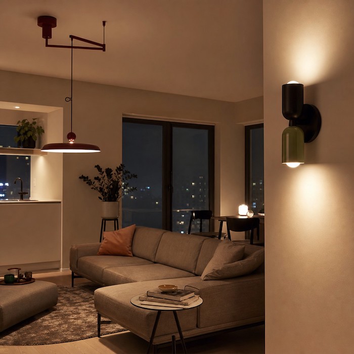 Wall sconce styled as part of a layered lighting scheme.