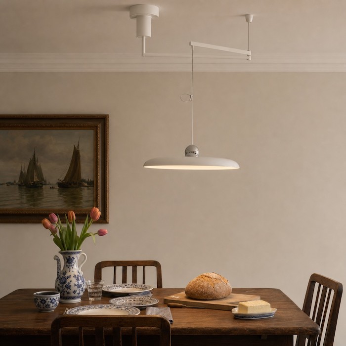 Swing arm pendant moving light toward the dining activity area.