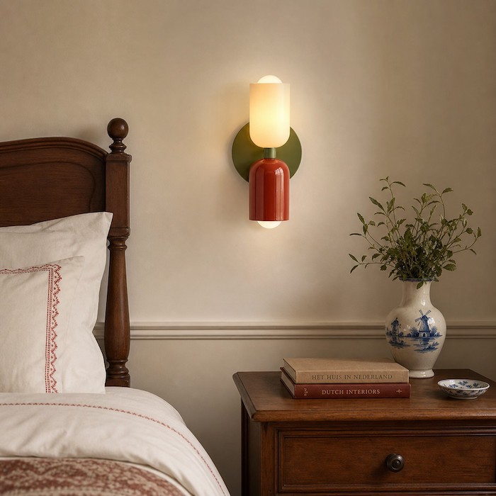 Bedroom wall sconce adding soft depth beside a bed.