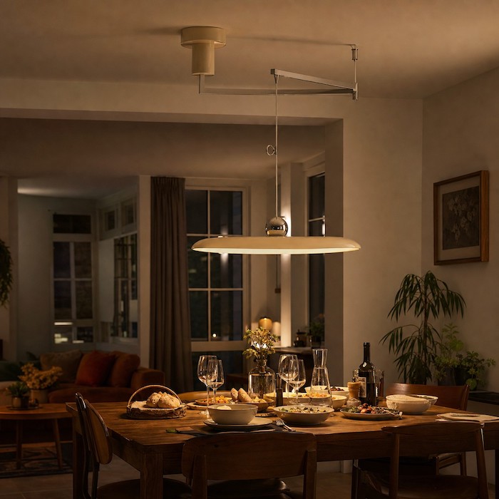 Warm pendant light creating a relaxed evening dining atmosphere.