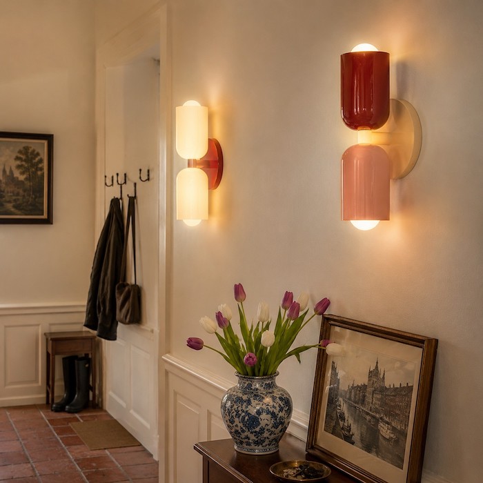 Low-glare wall sconces guiding movement along a narrow hallway.