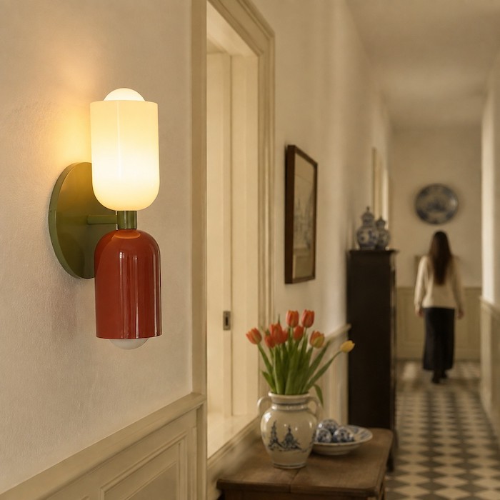 Two evenly spaced wall sconces creating a relaxed rhythm on a longer corridor wall.