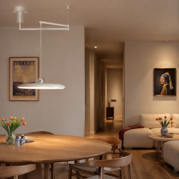 Single adjustable pendant handling focus while support lights cover movement and mood.