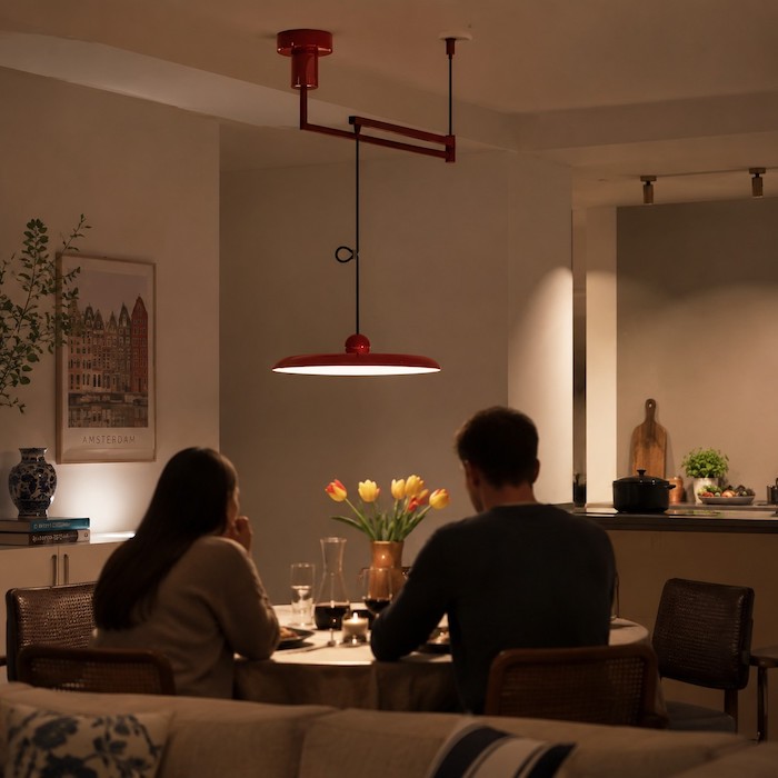 Evening open-plan room where pendant and track lighting work without overlapping roles.