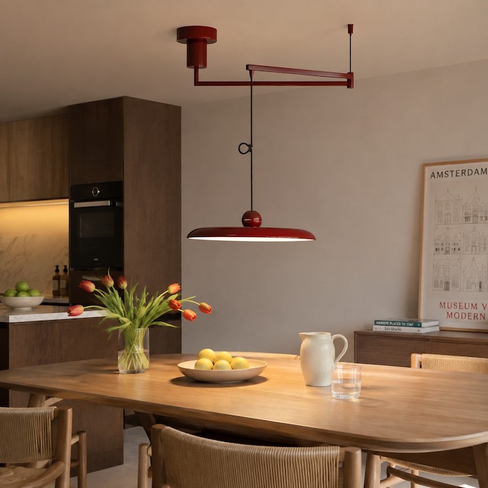 Clean ceiling and one movable pendant creating a calm dining focal point.