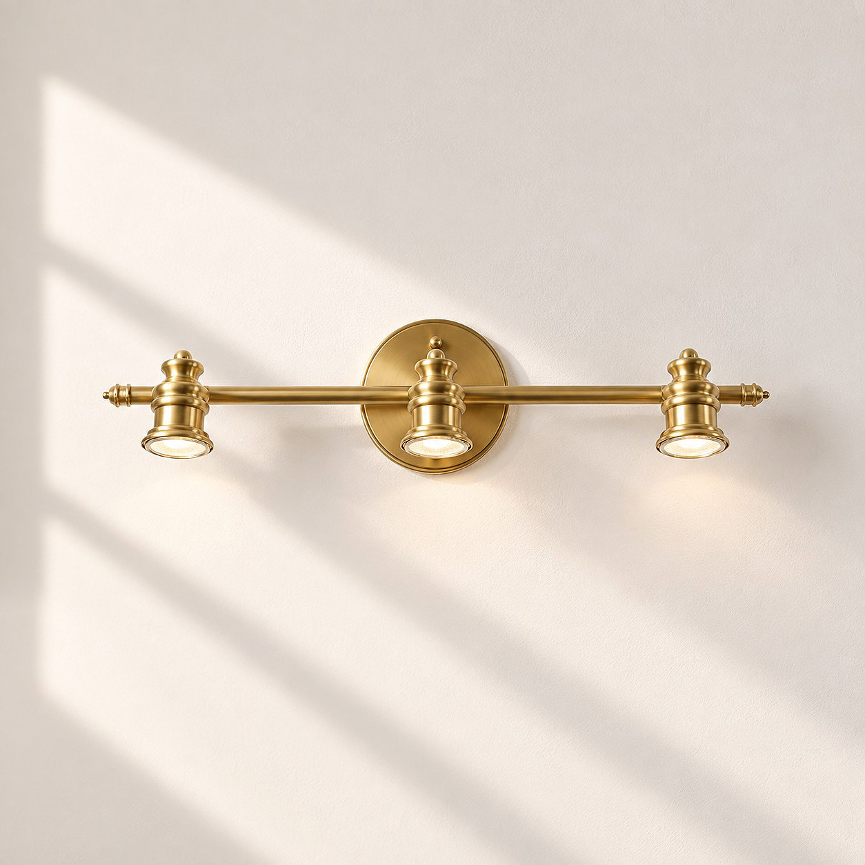Aurelia Brass Vanity Wall Light with sculpted shades and a linear wall bar