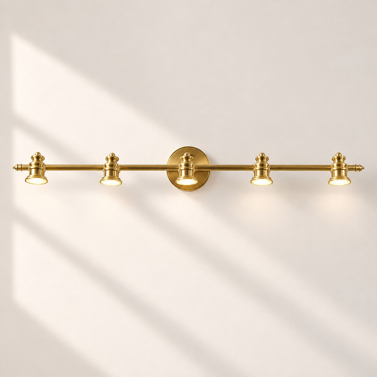 Aurelia Brass Vanity Wall Light with sculpted shades and a linear wall bar
