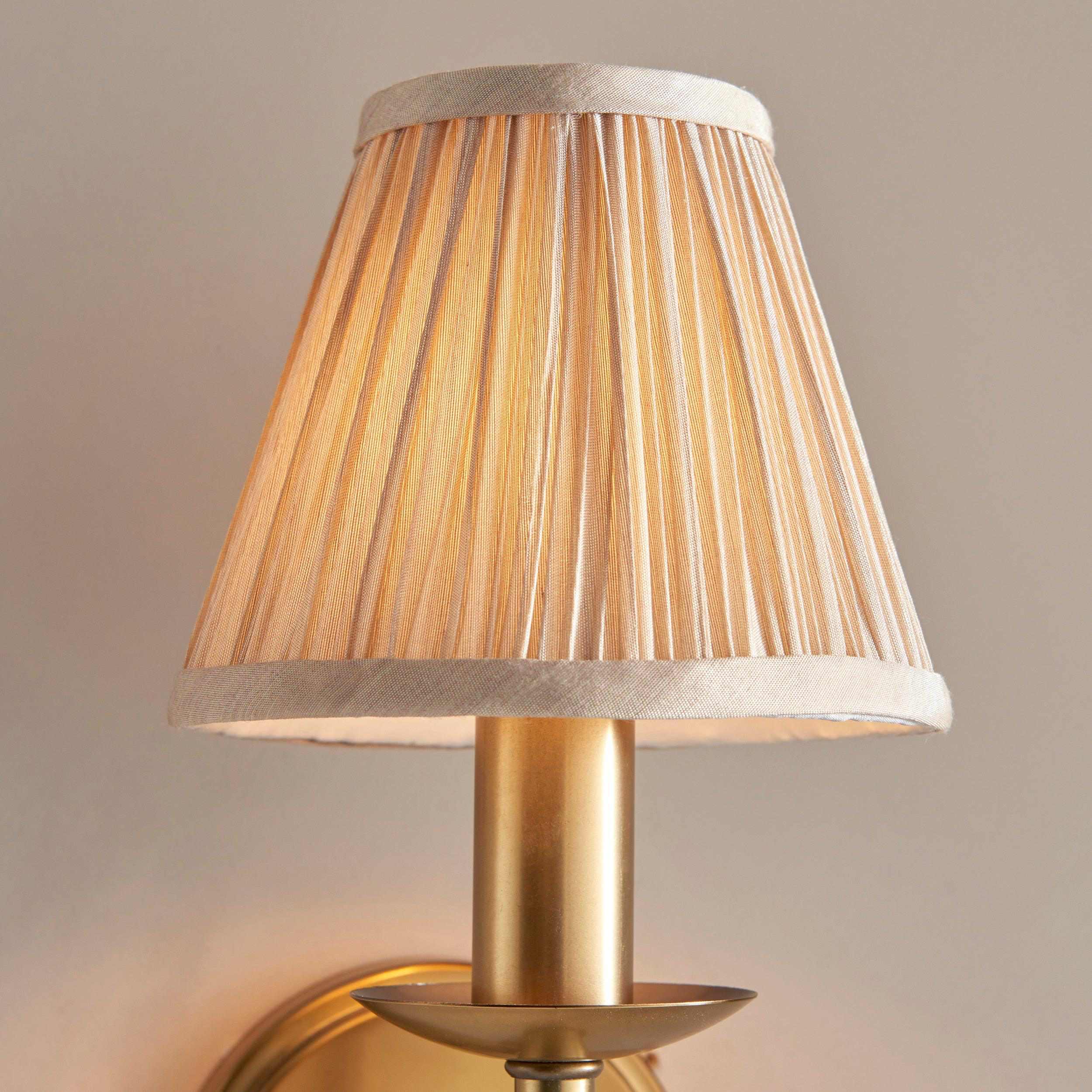 Close-up of Tela fabric shade and brass stem