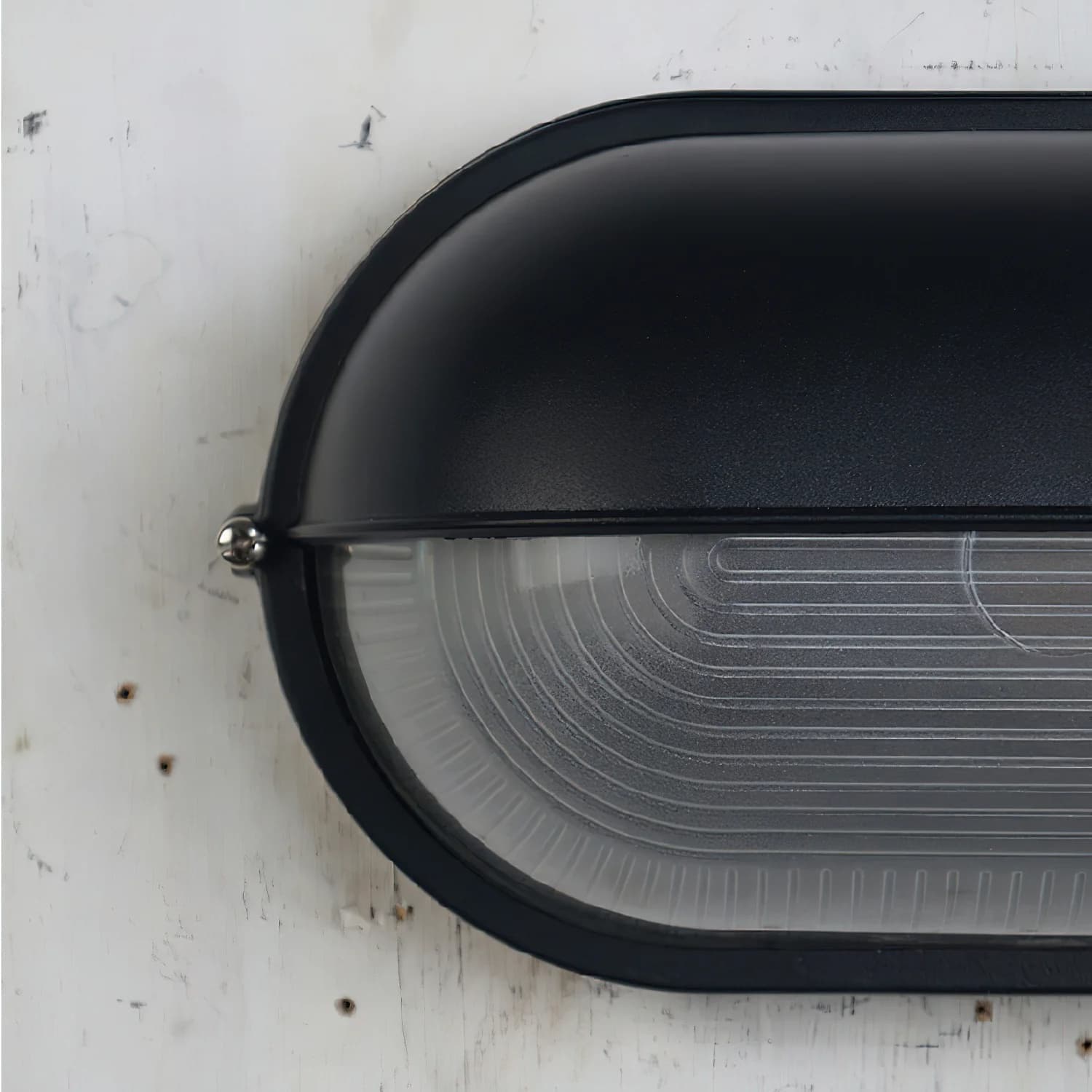 Detail van de Docka wandlamp met zwarte afwerking