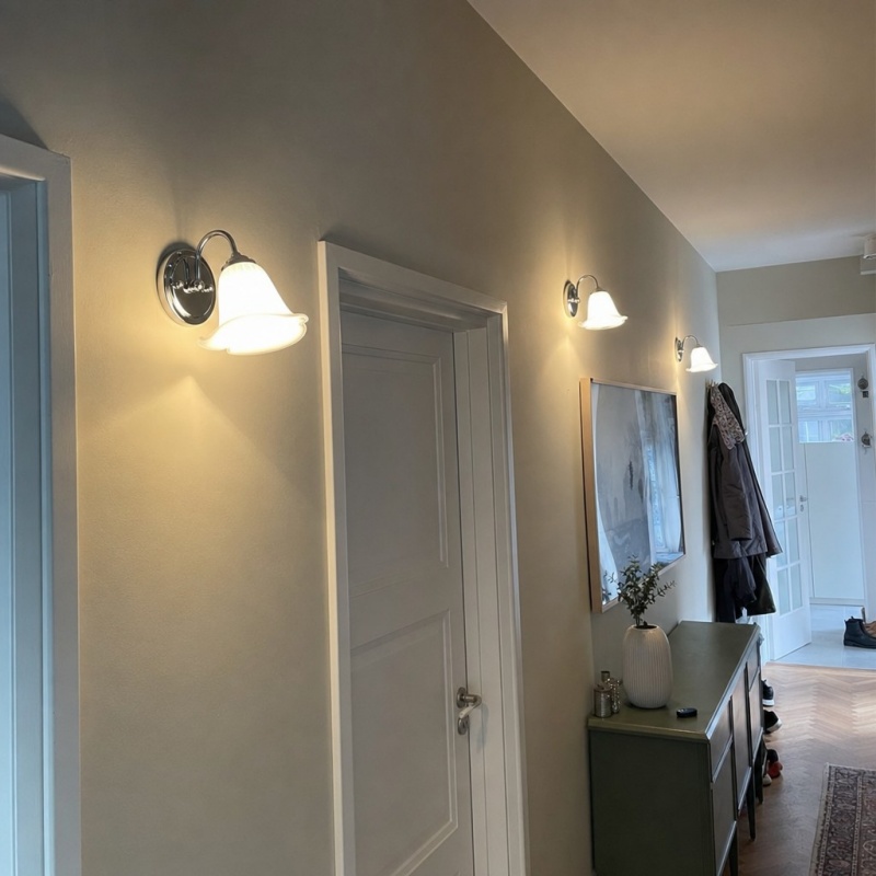 Customer photo of the illuminated wall lamp in a hallway