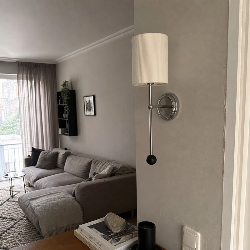 Klantfoto van Cumoris wandlamp in woonkamer