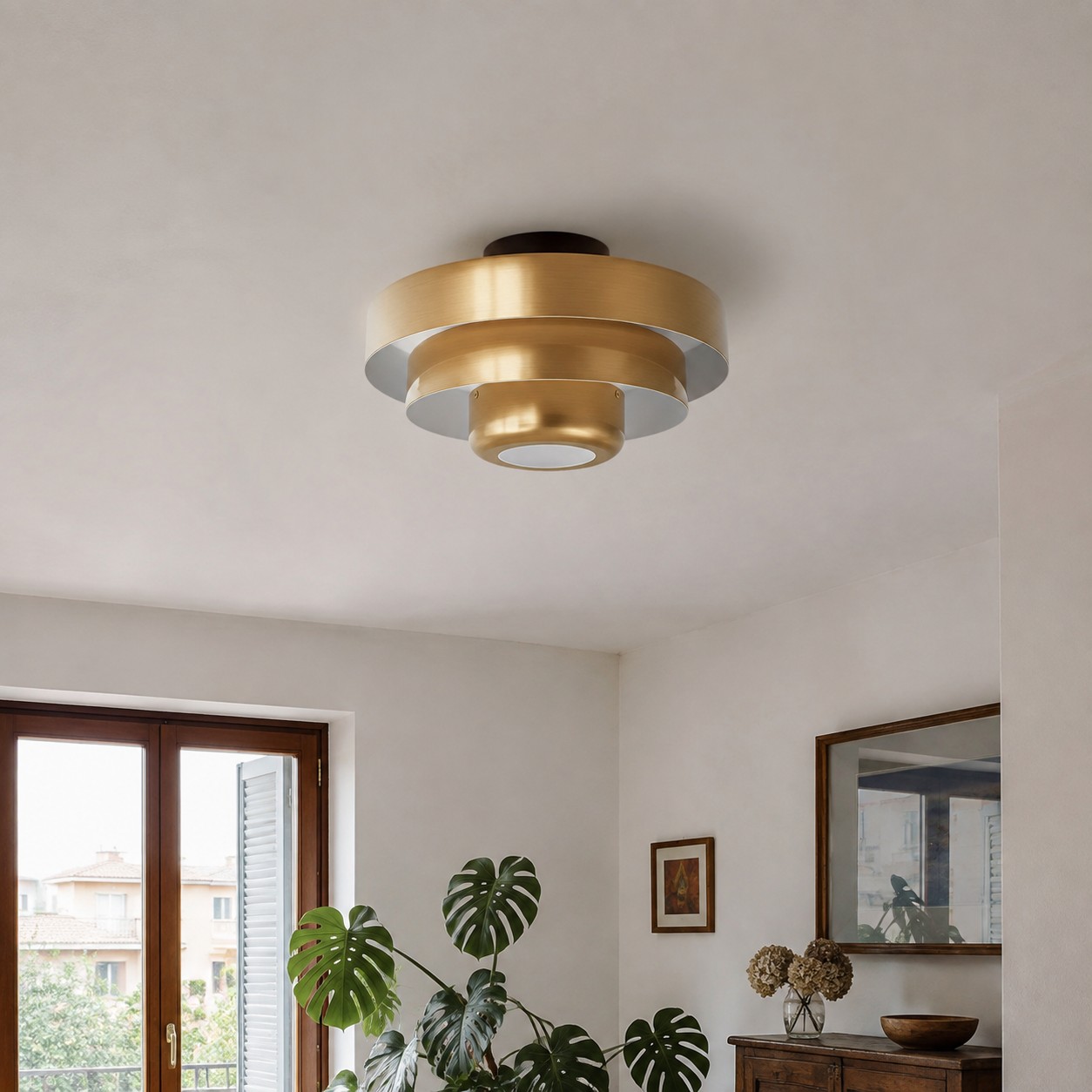 Brass Malero ceiling lamp in a modern living room