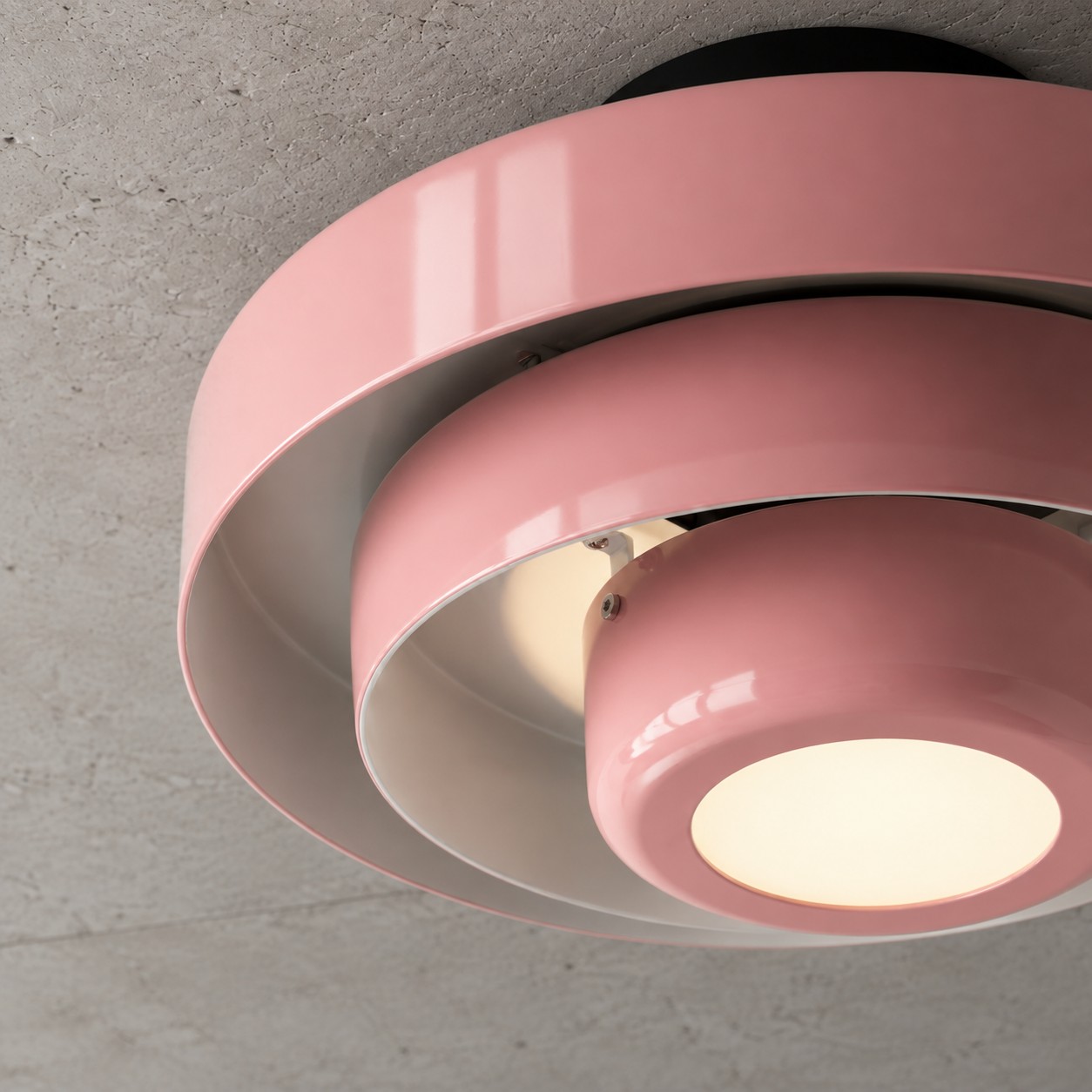Illuminated underside of the pink Malero ceiling lamp