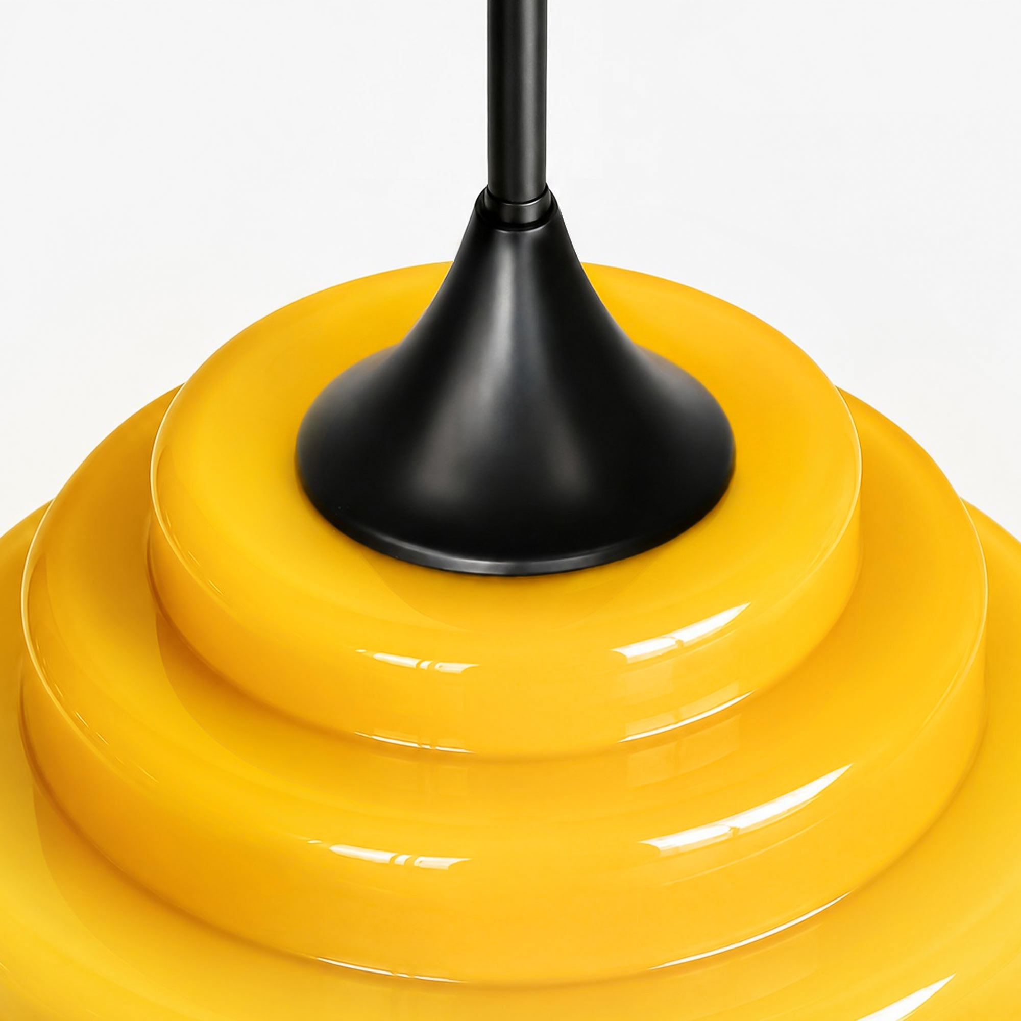 Close-up of the black canopy and yellow gradient glass