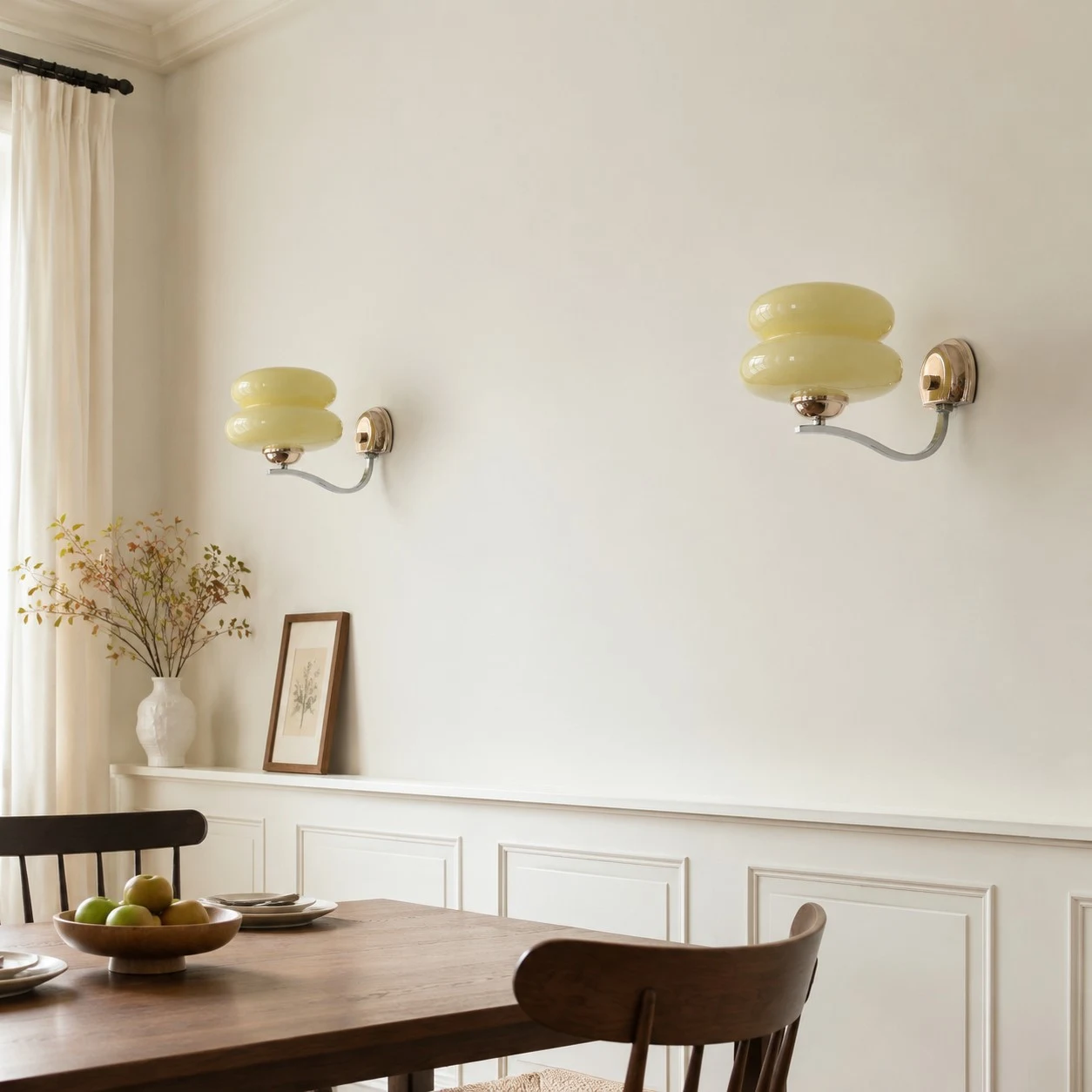Beige single-head wall sconces in a dining area