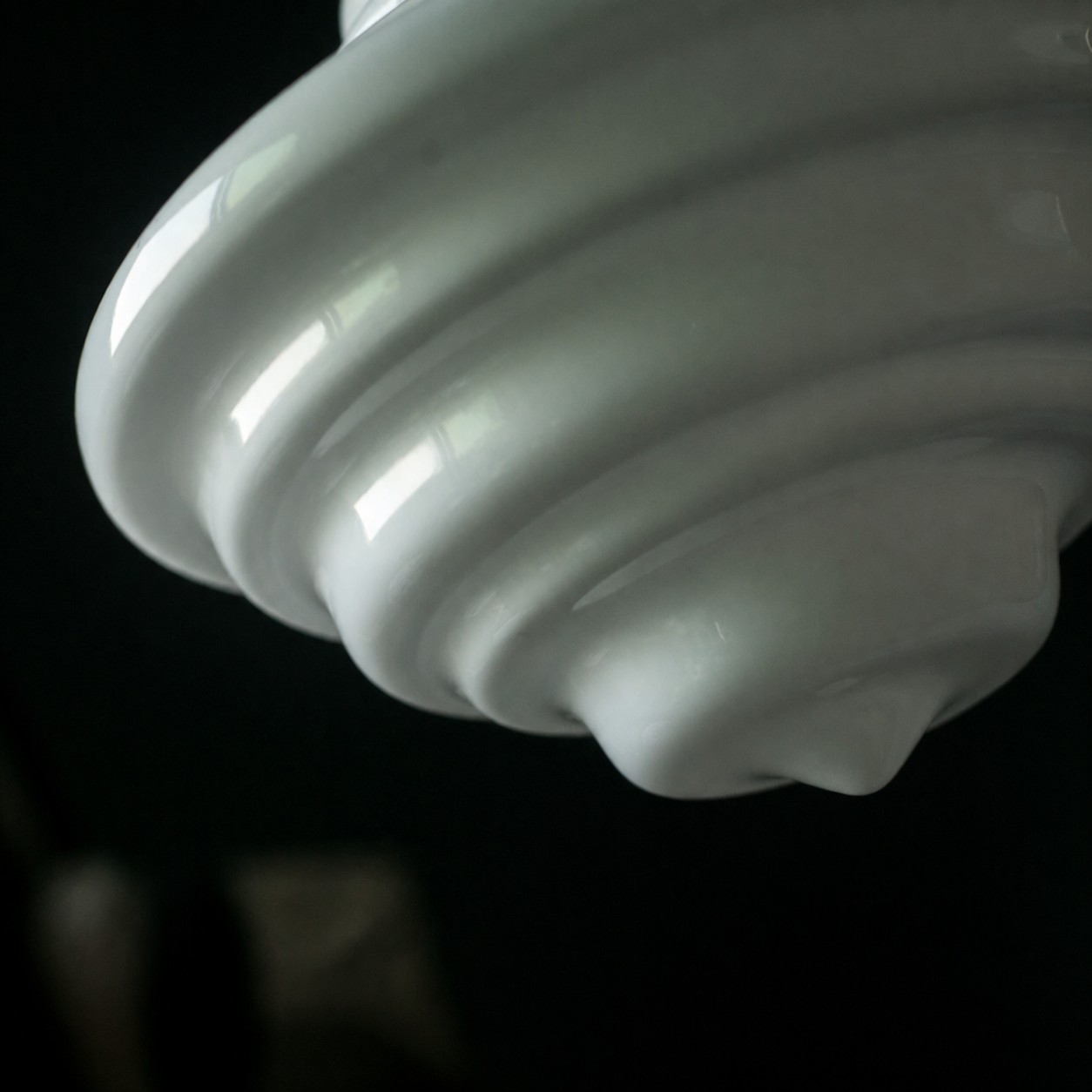 Glossy stepped white glass pendant detail