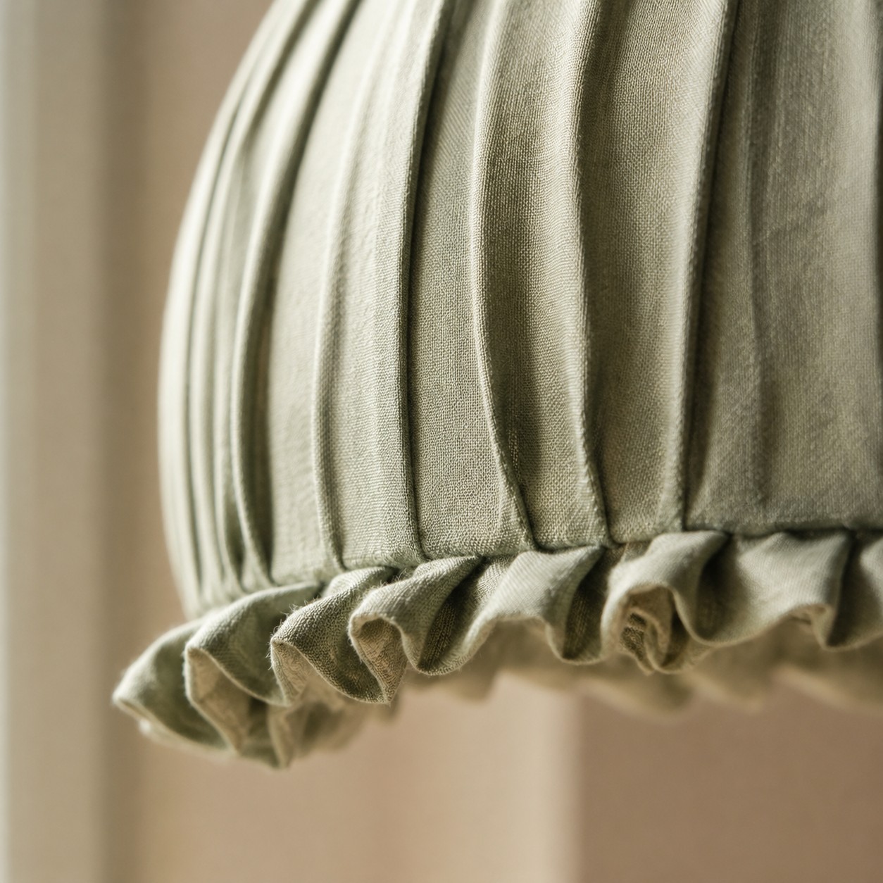 Close-up of the ruffled fabric shade edge