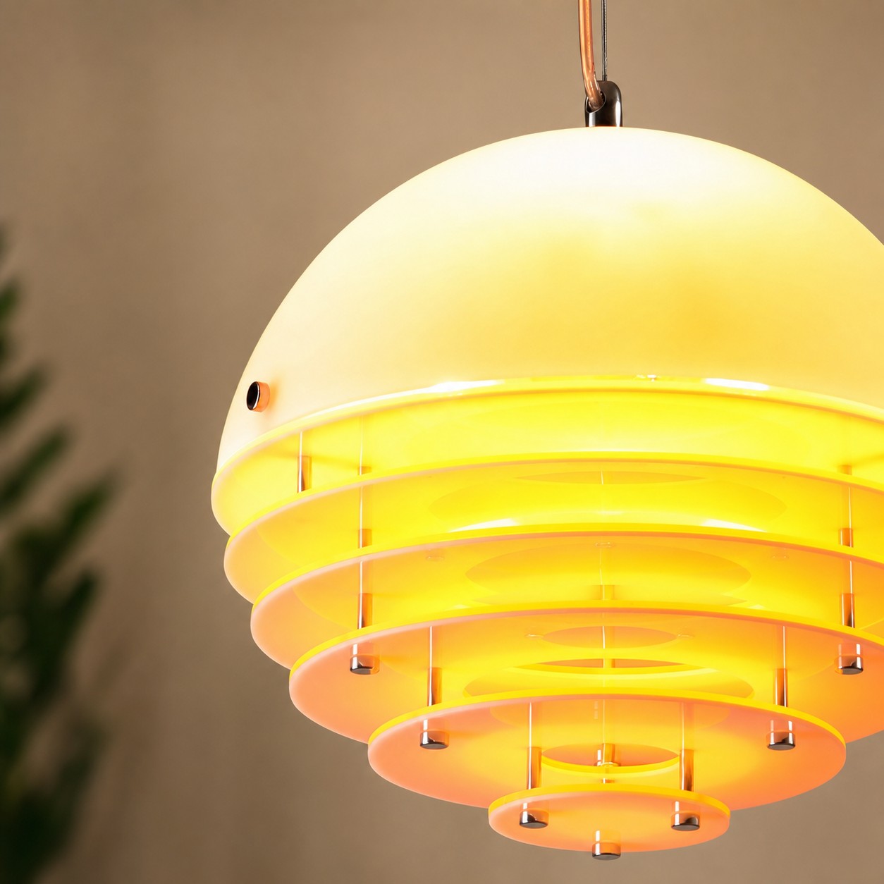 Close-up of the Bauhaus pendant lamp glowing warmly