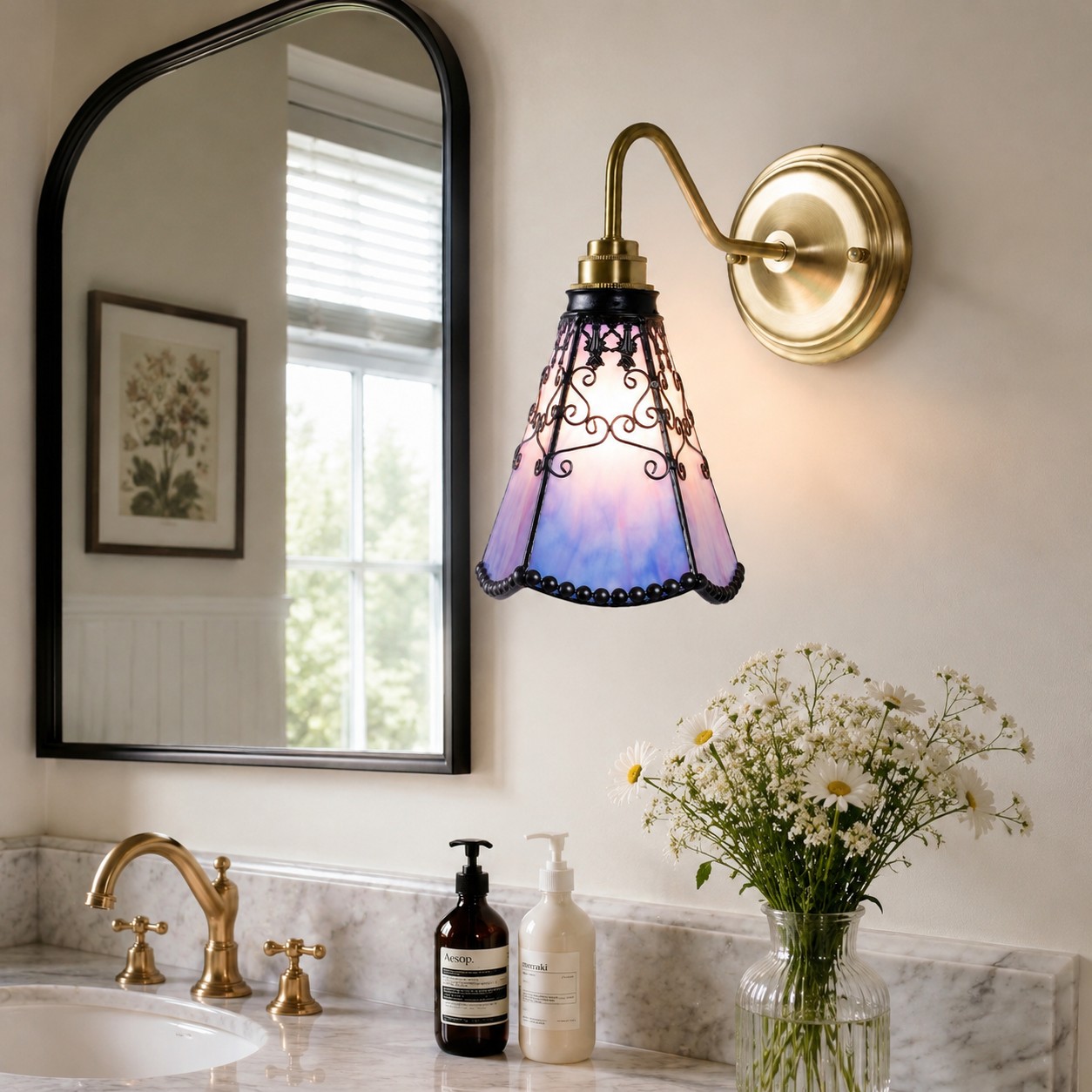 Gradient purple stained glass wall sconce beside a mirror