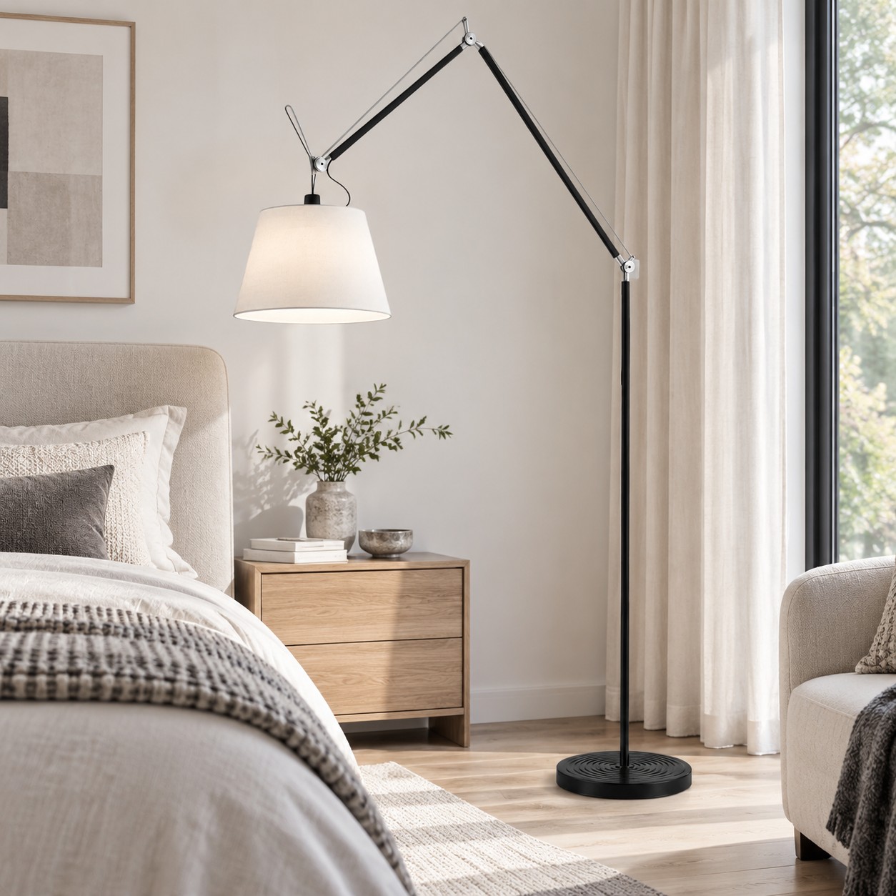 White shade floor lamp beside a bed