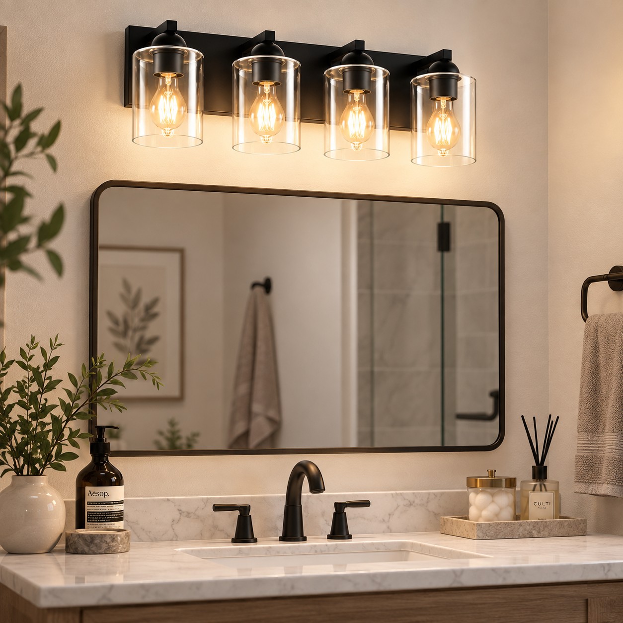 Glass Bathroom Vanity Light with cylindrical shades and a metal wall bar